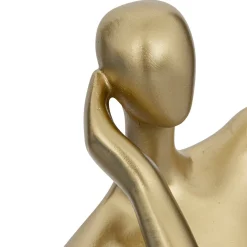 Estátua dourada figura de mulher